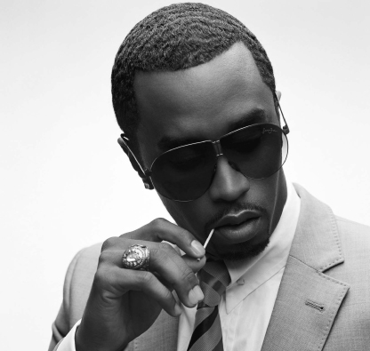 sean puff daddy combs with toothpick and sunglasses on
