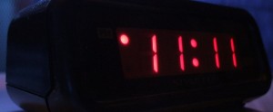 picture of bedside alarm clock reading 11:11
