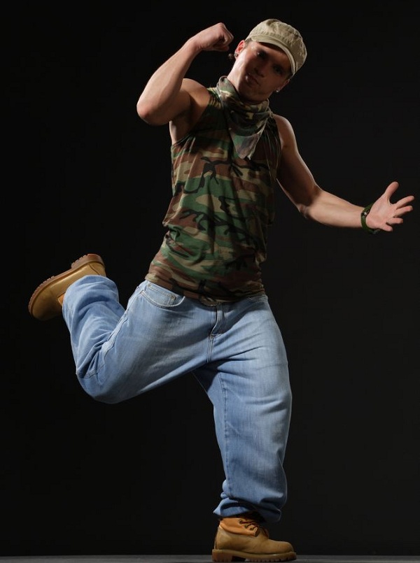 style-conscious military dancer making a fist in mid air
